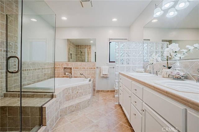 full bathroom featuring toilet, vanity, tile patterned flooring, and independent shower and bath