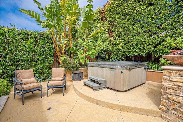 view of patio / terrace featuring a hot tub