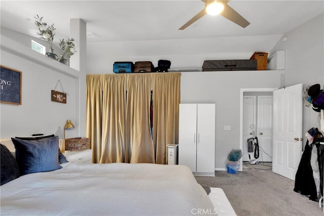 bedroom featuring ceiling fan, lofted ceiling, and carpet floors