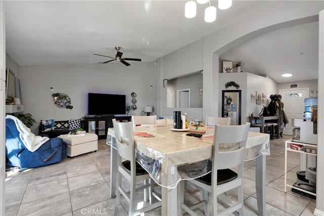 tiled dining space featuring ceiling fan