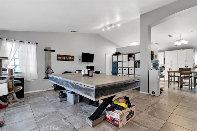 game room featuring light tile patterned floors and lofted ceiling