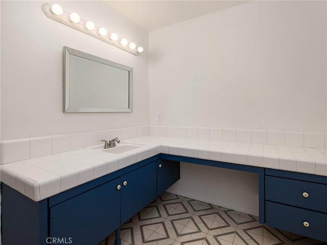 bathroom with vanity and tile patterned floors