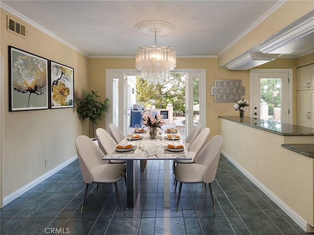 dining area with a chandelier and crown molding