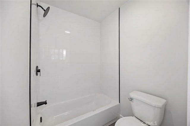 bathroom with toilet and tiled shower / bath combo