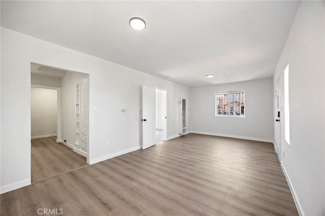 empty room featuring hardwood / wood-style floors