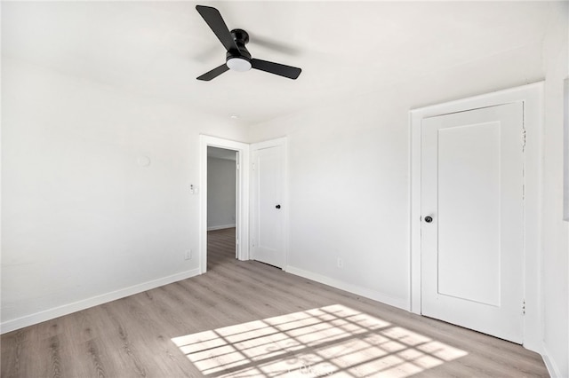 unfurnished bedroom featuring light hardwood / wood-style floors and ceiling fan