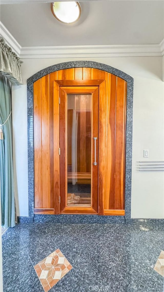 spare room featuring crown molding