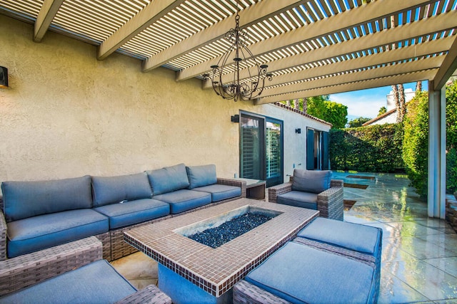 view of patio with a pergola and an outdoor living space with a fire pit