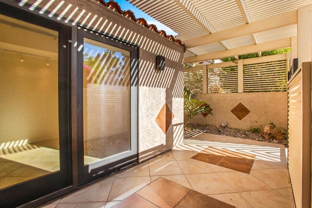 doorway with light tile patterned floors