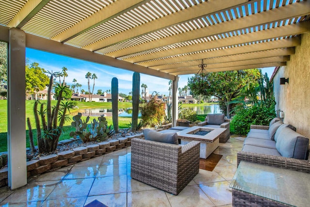 view of patio / terrace featuring a water view, a pergola, and an outdoor living space with a fire pit