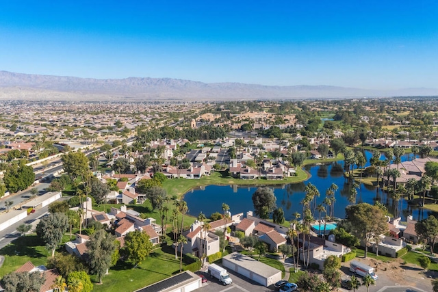 aerial view featuring a water and mountain view