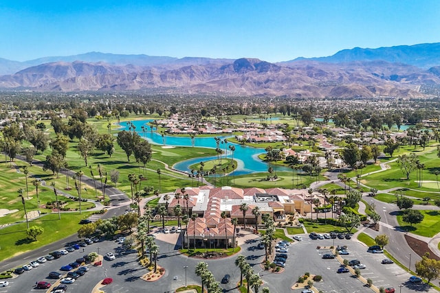 drone / aerial view featuring a water and mountain view