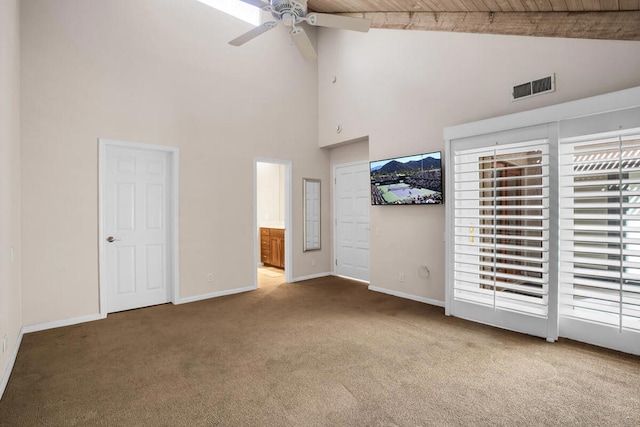 interior space with wood ceiling, ceiling fan, carpet, high vaulted ceiling, and beamed ceiling