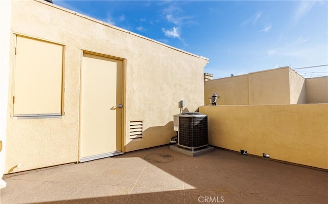 exterior space with a patio area and central AC