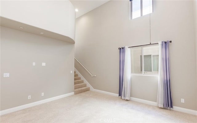 unfurnished living room with light carpet