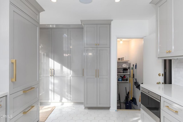 kitchen with light tile patterned floors and built in microwave