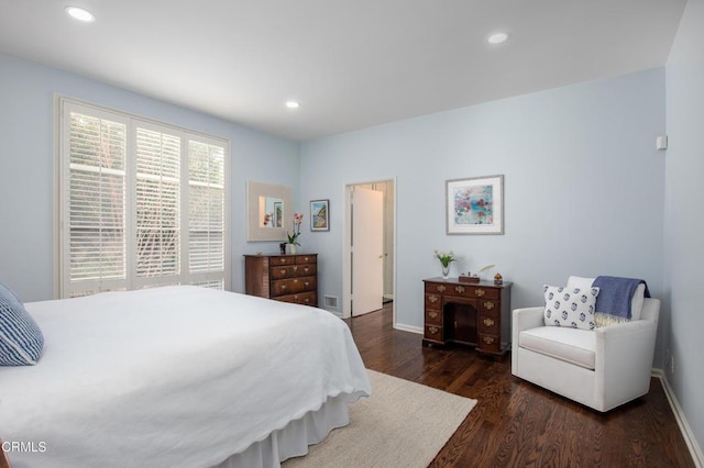 bedroom with dark wood-type flooring