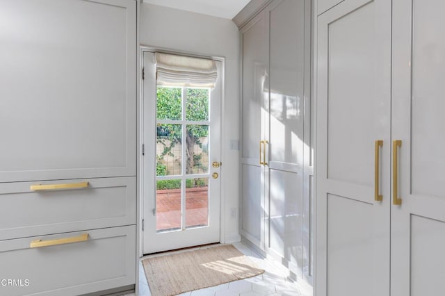 entryway featuring light tile patterned floors