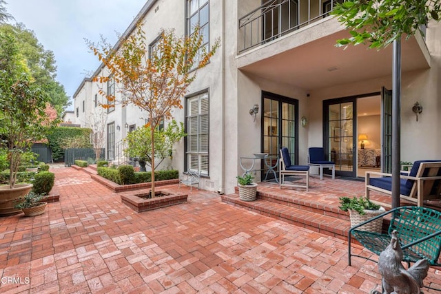 view of patio / terrace with a balcony