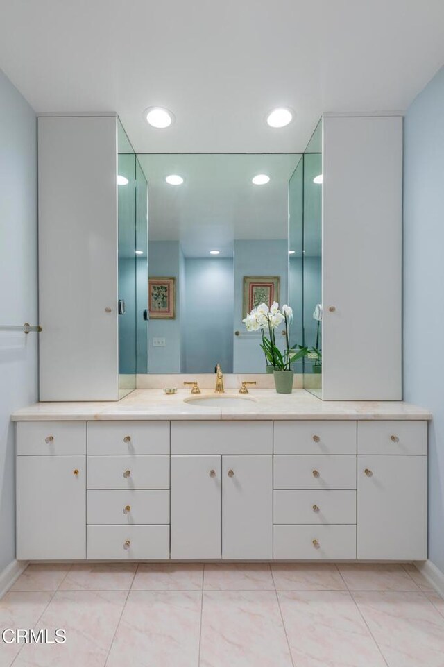 bathroom with tile patterned floors and vanity