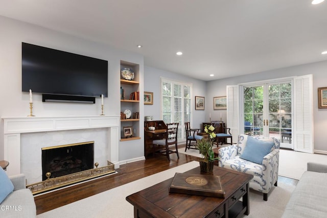 living room featuring a fireplace and hardwood / wood-style flooring