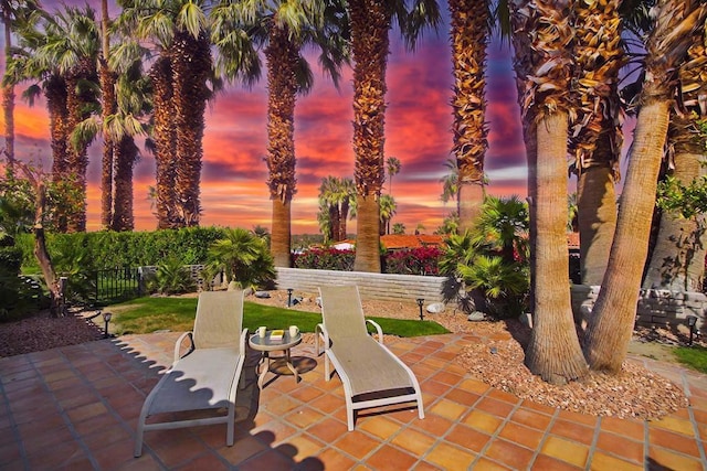 view of patio terrace at dusk