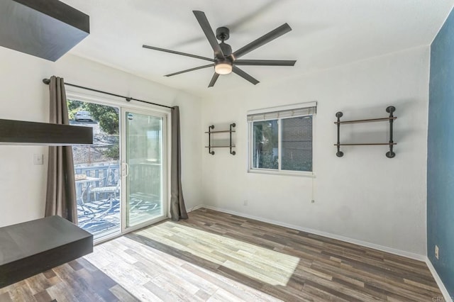 spare room with hardwood / wood-style floors and ceiling fan