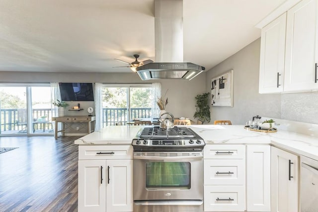 kitchen featuring white cabinetry, plenty of natural light, stainless steel range with gas cooktop, and island range hood