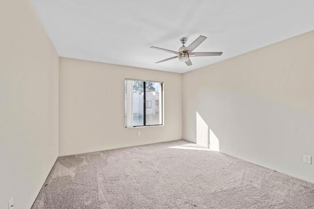 empty room featuring ceiling fan and carpet floors