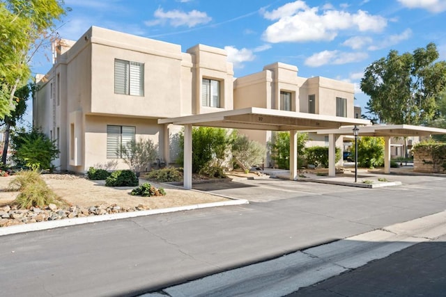 exterior space with a carport