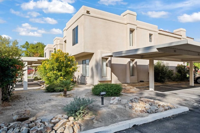 view of side of property featuring a carport