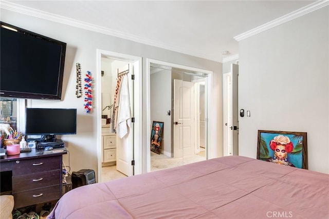 bedroom featuring ensuite bathroom, a closet, and ornamental molding