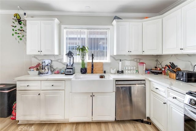 kitchen featuring sink, white cabinetry, appliances with stainless steel finishes, and crown molding