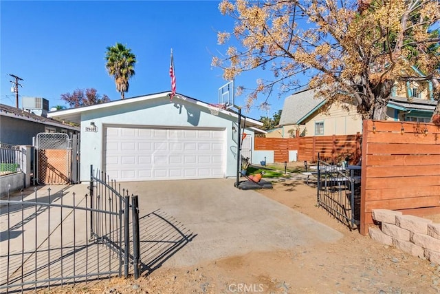 view of front of property featuring a garage and an outbuilding