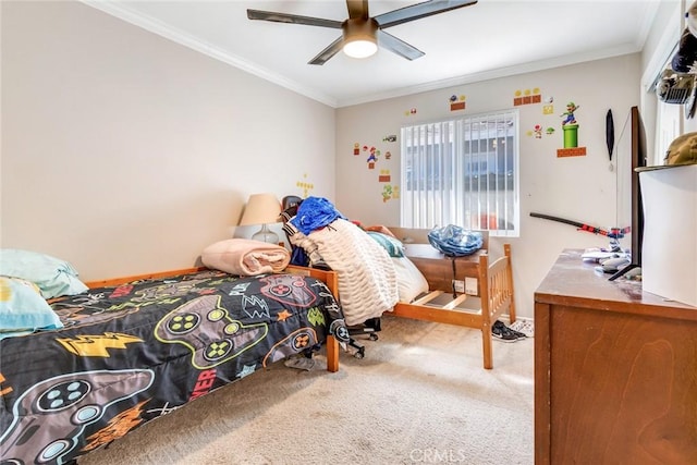 carpeted bedroom featuring ceiling fan and ornamental molding