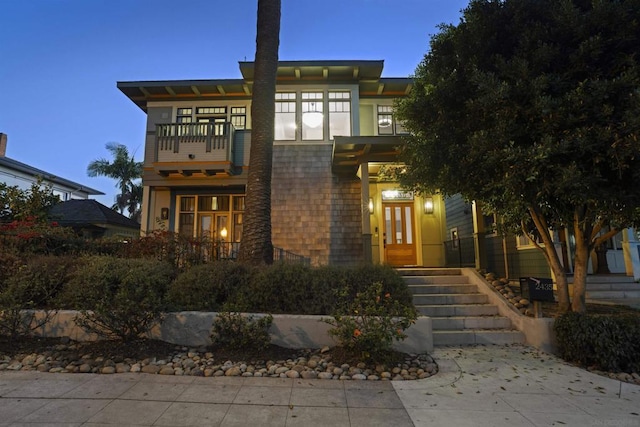 view of front of property with a balcony