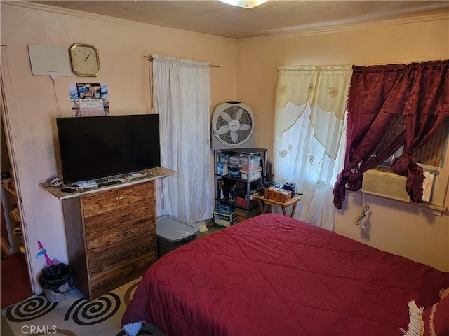 bedroom featuring crown molding and cooling unit