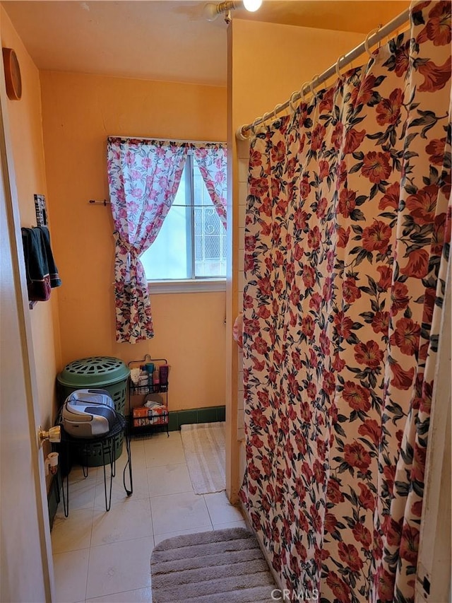 bathroom with tile patterned floors