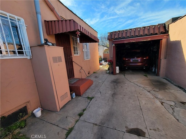 view of side of home with a garage