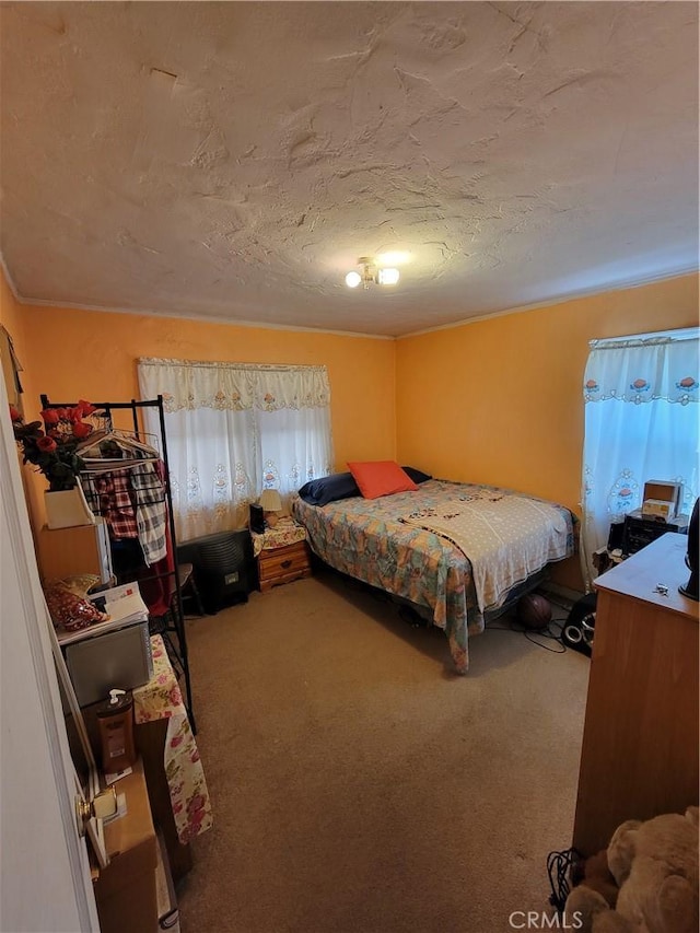 carpeted bedroom featuring a textured ceiling