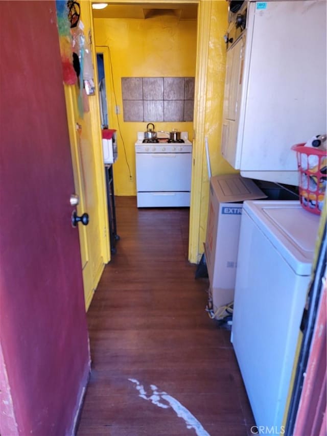 interior space with dark hardwood / wood-style flooring and washer / dryer