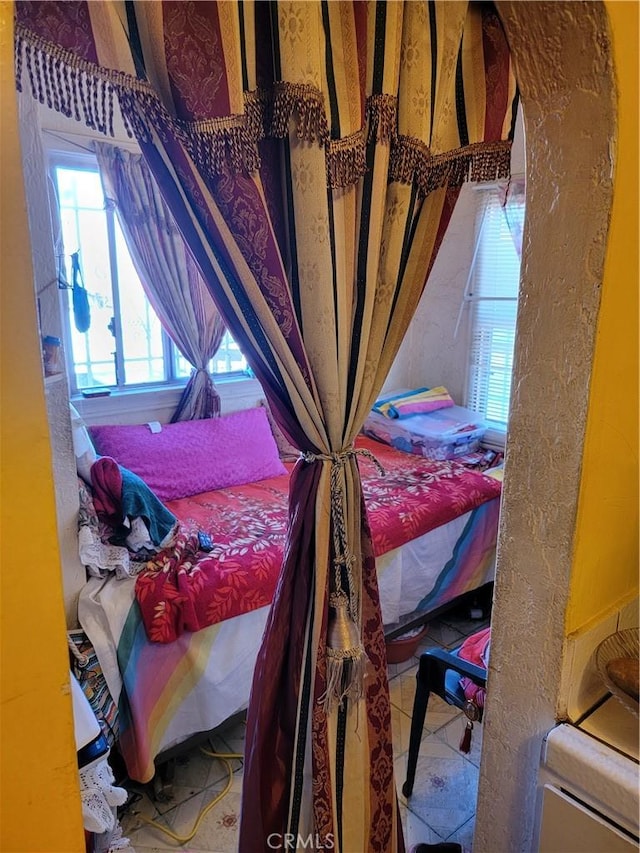 bedroom featuring tile patterned flooring