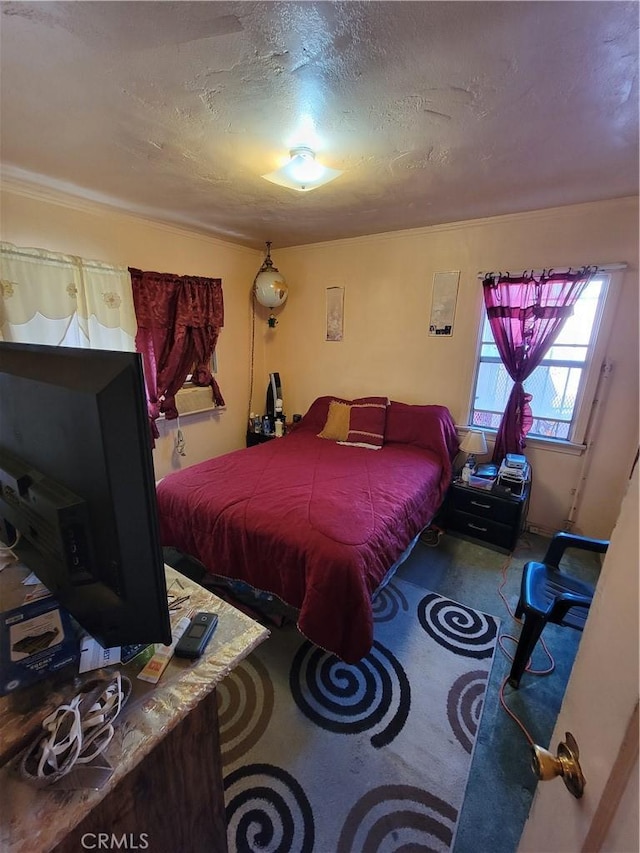 carpeted bedroom featuring a textured ceiling