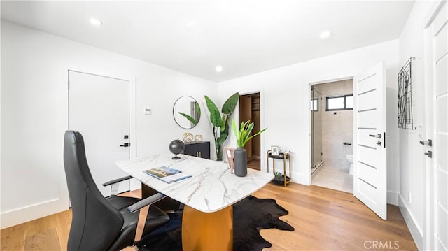 office with light hardwood / wood-style floors