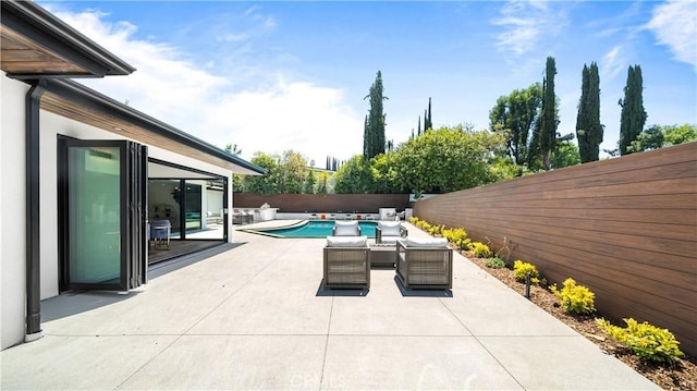 view of patio / terrace with a fenced in pool