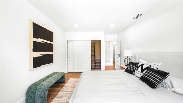 bedroom featuring a closet and hardwood / wood-style floors