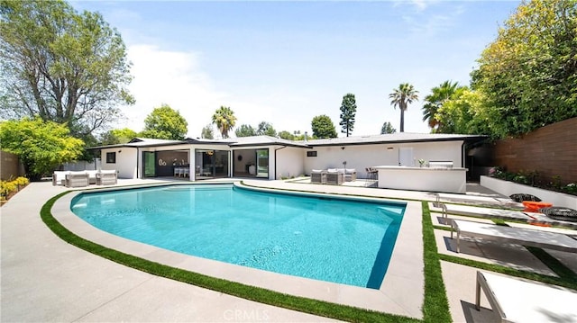 view of pool featuring a patio area and outdoor lounge area