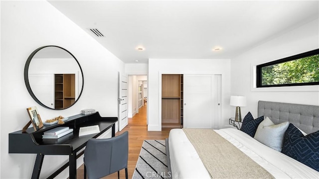 bedroom with hardwood / wood-style flooring