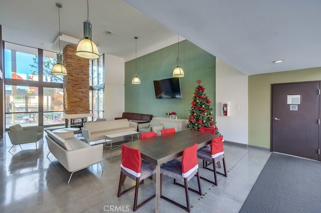 dining space featuring a high ceiling