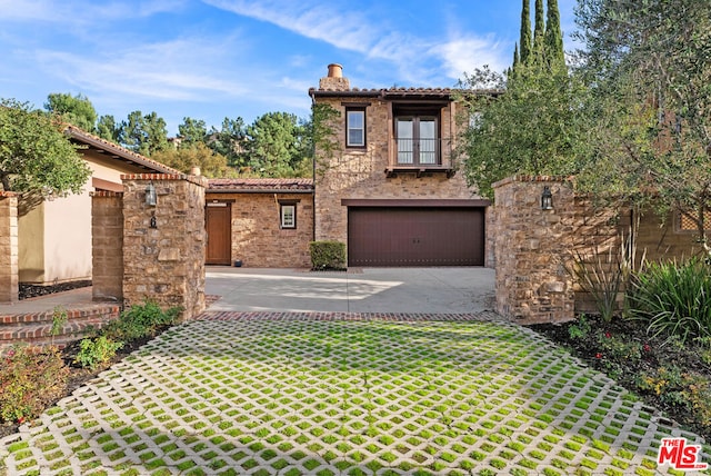 mediterranean / spanish house featuring a garage